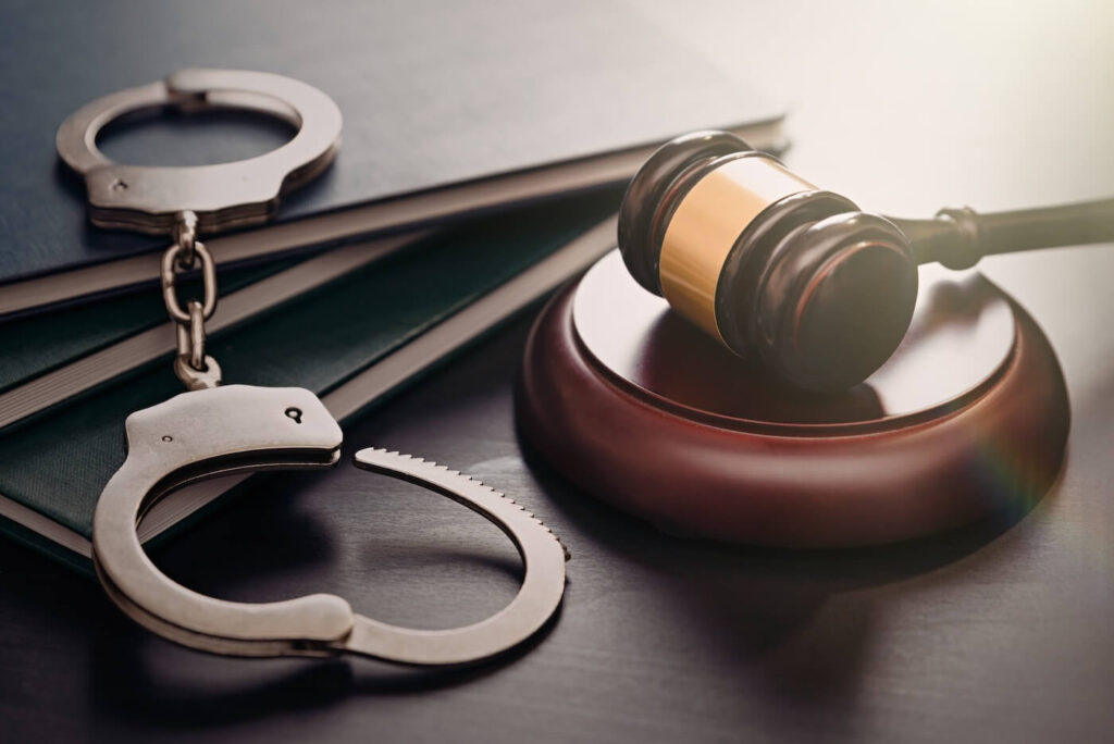 Handcuffs and a wooden hammer