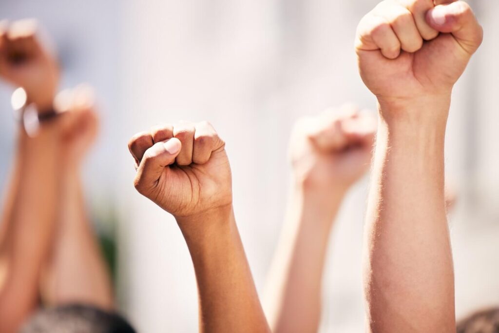 Fists, and people protesting with teamwork
