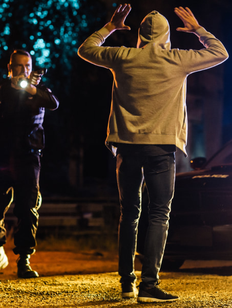 Police Man Arresting a Person